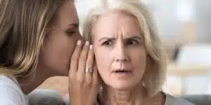 adult daughter share secret with surprised aged mom picture id1070272168