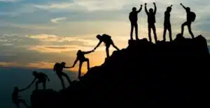 group of people on peak mountain climbing helping team work travel picture id1009803562