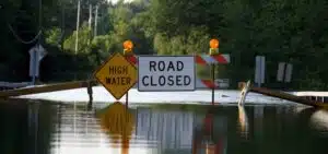 road closure signage as water covers the road picture id147243623 1