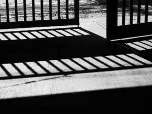 steel door with sunlight shining through black and white