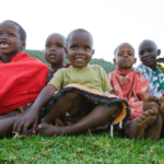 african children sitting and smiling