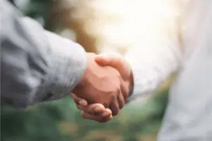 two people shaking hands